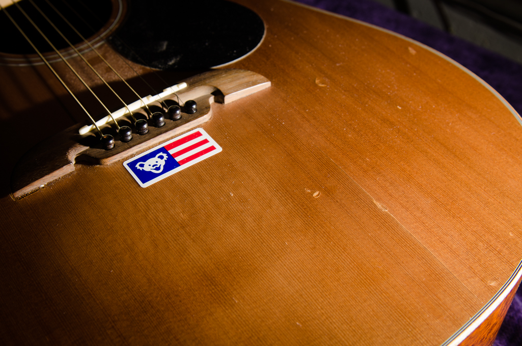 Bridge lifting and top crack on this cedar-top Alvarez.