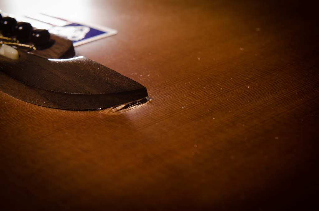 Pieces of the cedar top being pulled from the soundboard.