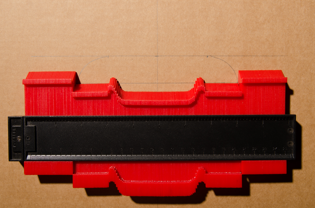 The bridge dimensions are transferred to a piece of corrugated cardboard.