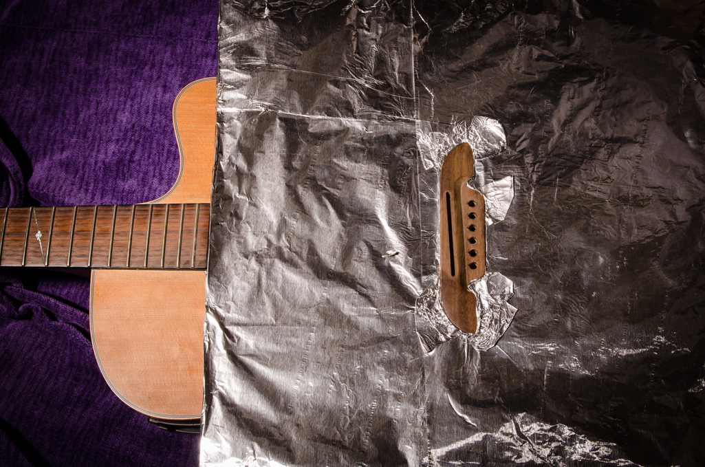 The cardboard heat shield is covered with aluminum foil.