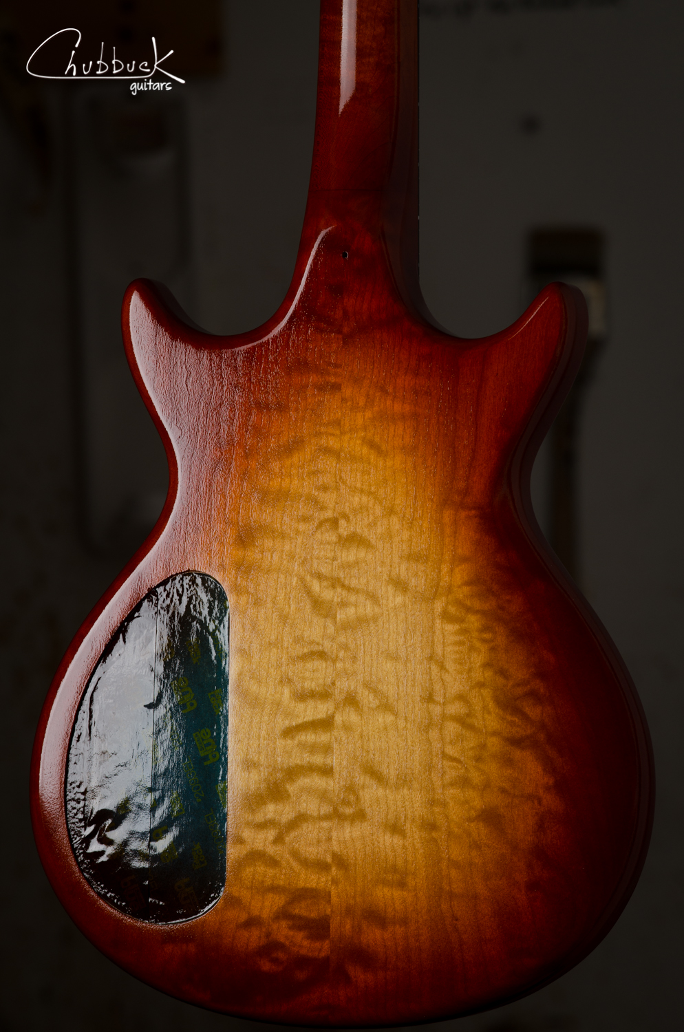 Here is the back view in the booth. You can see the texture or "orange peel" that will be scuff sanded after the first round of clear coats have dried in prep for more top coats.