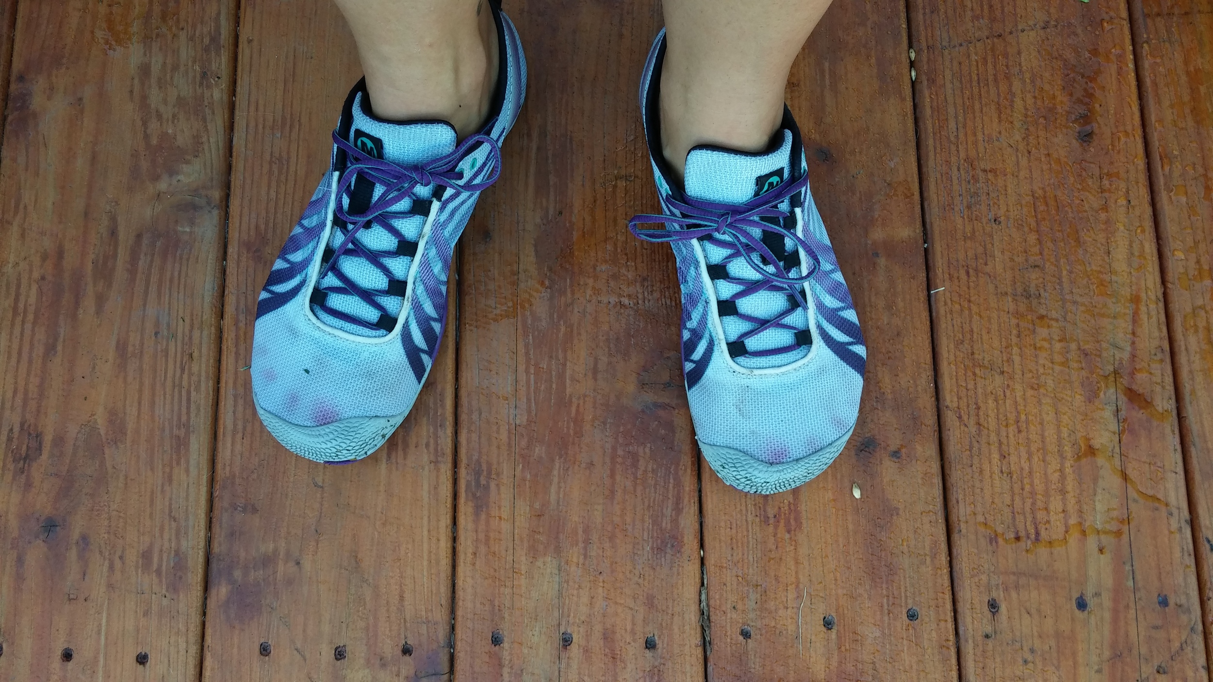 My running shoes, back in August, toes stained by my nail polish. 