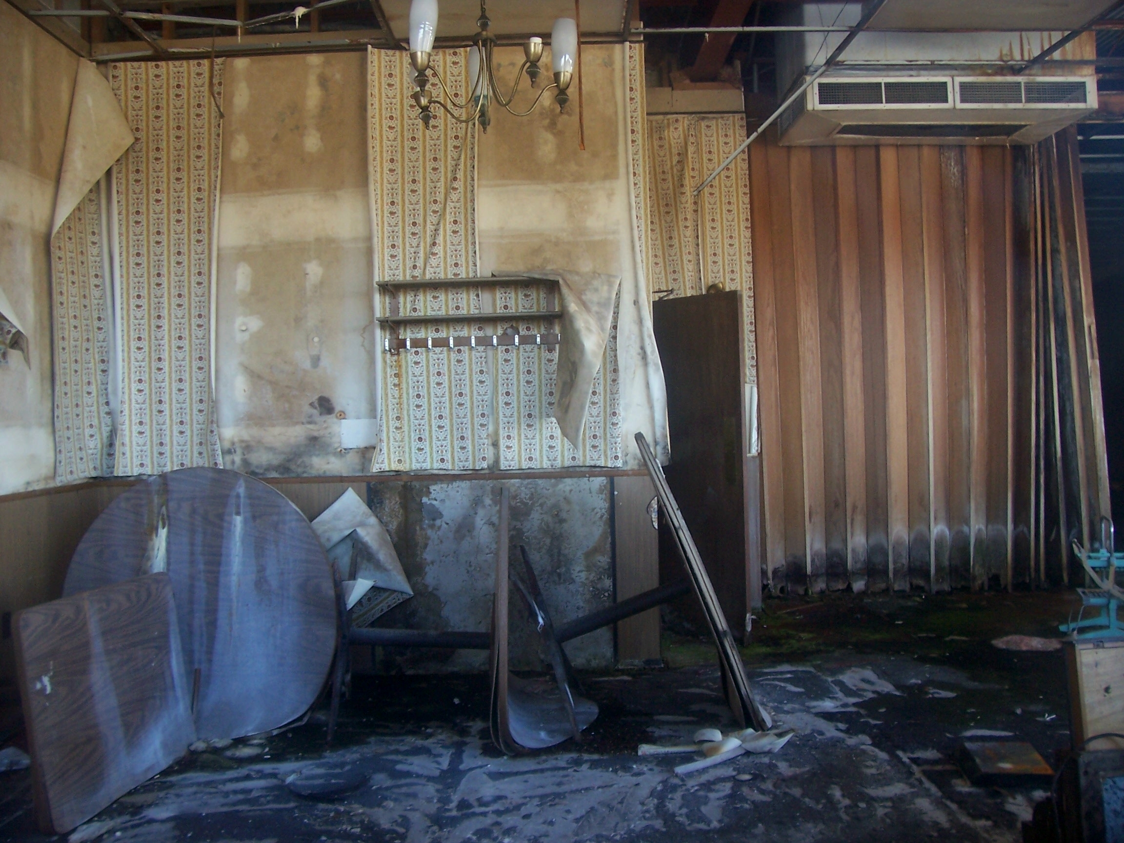 Abandoned buildings are kind of scary. This is the interior of the Diamonds Restaurant in Gray Summit, Missouri, in 2005, shortly before the building was torn down. I worked there in high school. 