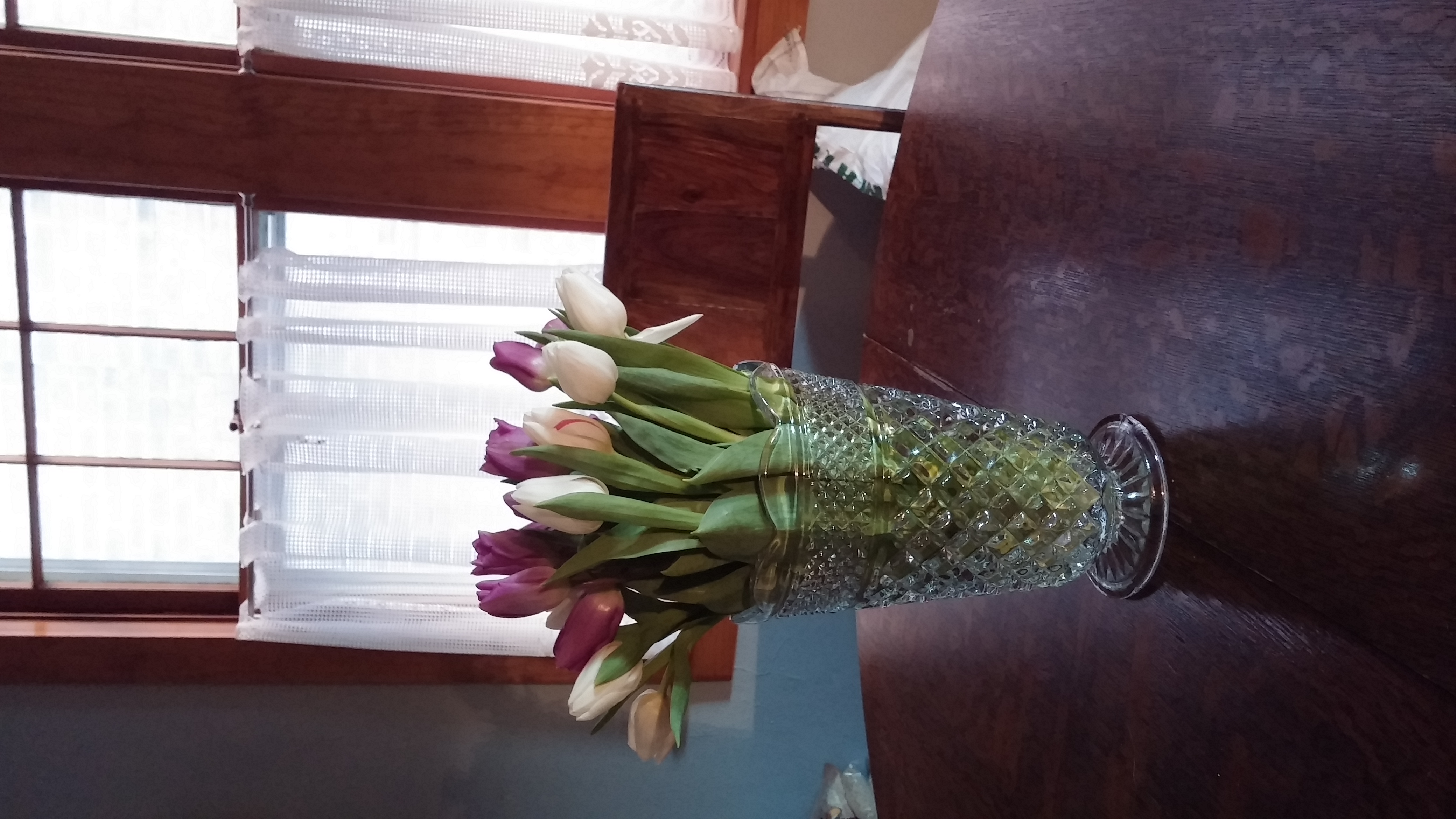 I buy flowers for the house during the winter, because they are cheerful and bright. And I love that vase, even if Eric says it looks like something his grandmother would have owned. 
