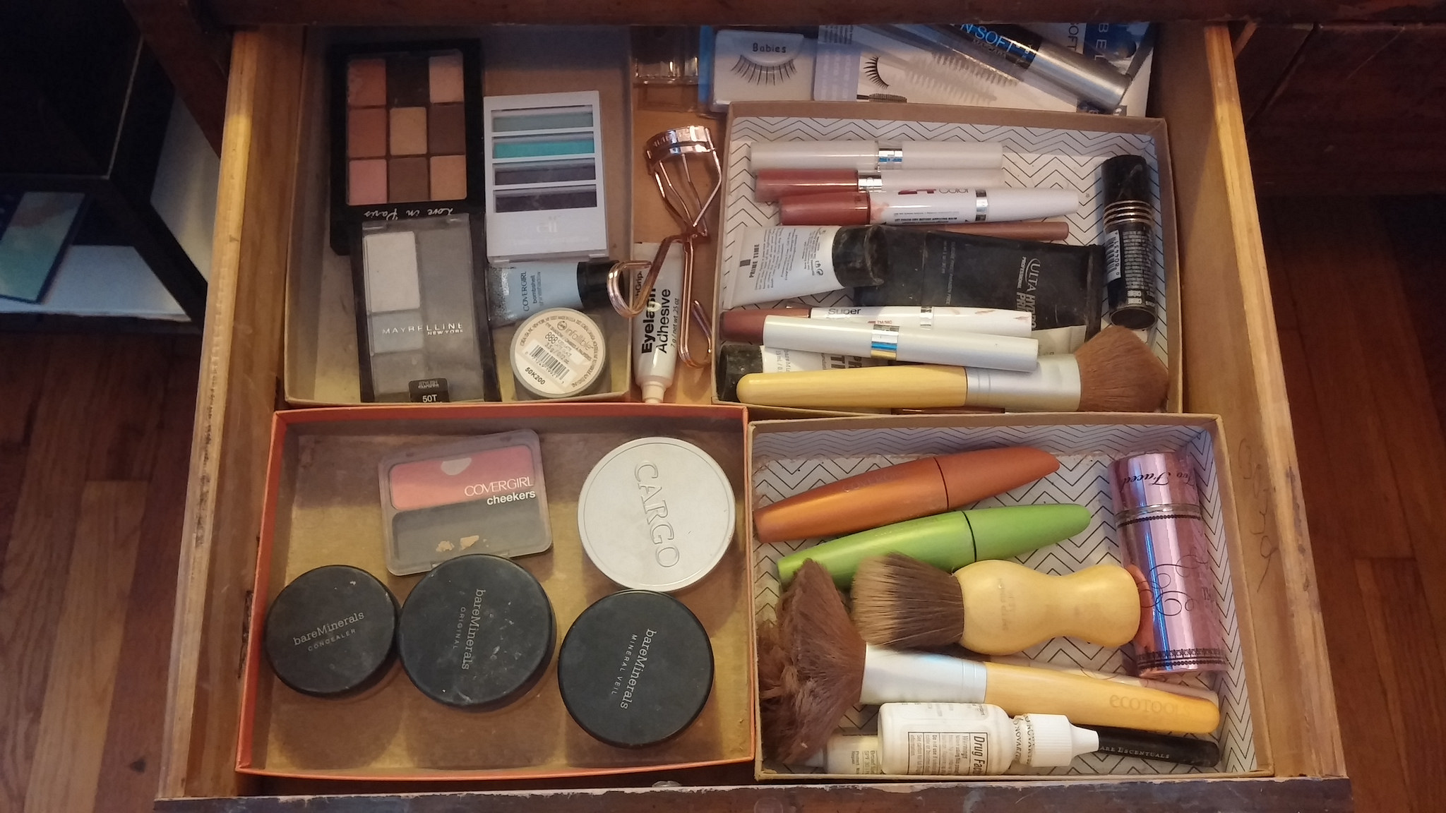 My neglected makeup drawer, with my frugal cardboard box organizational system. 