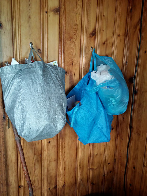 Recycling center with embarrassingly large bag of plastic bags on the right. 