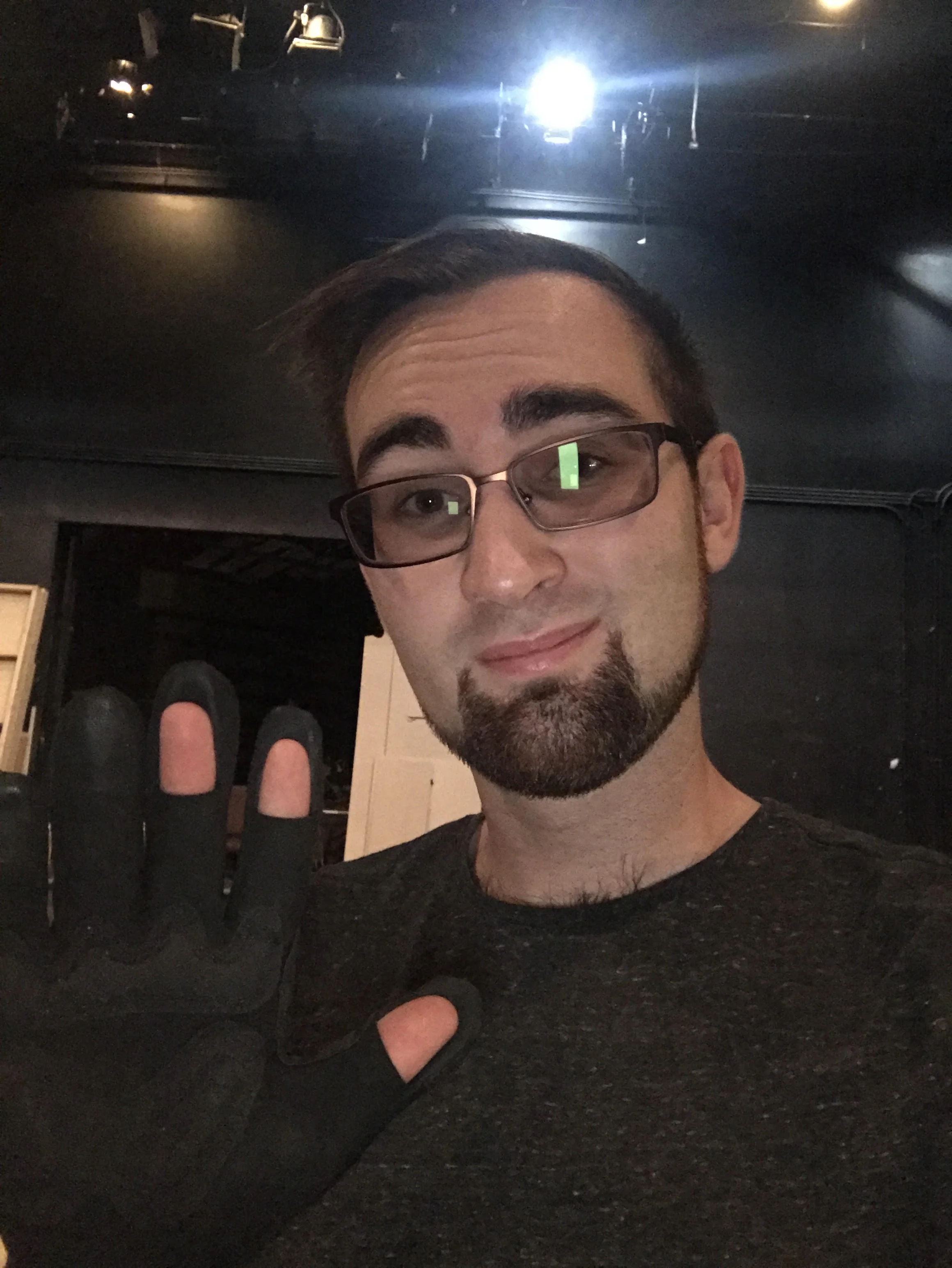 Lighting designer and theatrical electrician Mitchell Jakubka wearing his Gig Gloves ONYX on the job. 