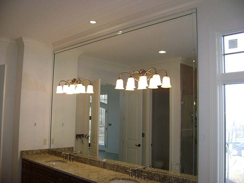 Vanity Mirror with Fabrication for Light Fixtures and Custom Bevel Strip Overlay