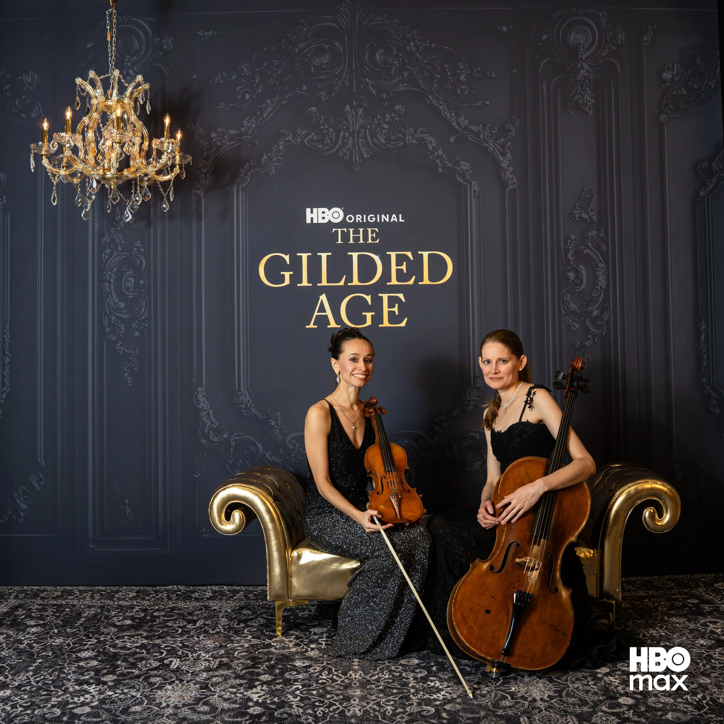 two attractive women playing violin and violoncello (cello)