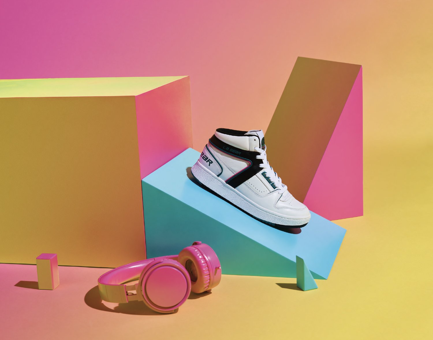 LA Gear Product Photography: Shoe Ad Highlight every shoe detail with sharp lighting to show textures and bold colors. Use minimalist backgrounds to keep the shoe the focus. Include action shots for movement and style, plus close-ups of laces, logos