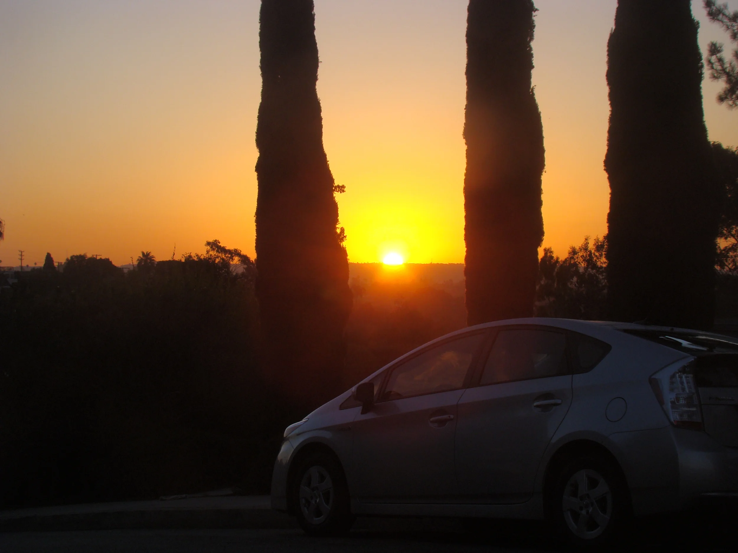 Sunrise over my Prius on Ashland at 14th in Santa Monica.... Never lose a Holy curiosity. Stop every day to understand and appreciate a little of the Mystery that surrounds you, and, your life will be filled with awe and discovery to the very end. …Albert Einstein
