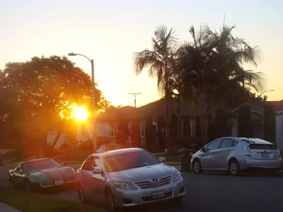 Sunrise over my Prius across the street in the new 'hood. First exploration Angeles Vista Blvd. for the best vantage point....not found yet. Life is a cup to be filled not drained. …Anonymous