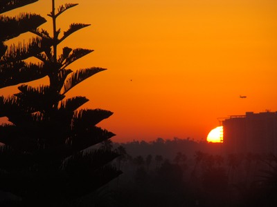 Sunrise peaks from behind a building as it begins its long journey to the North. Peace cannot be kept by force. It can only be achieved by understanding. …Albert Einstein