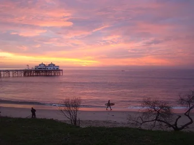 Sunrise for another photographer and a surfer heading for launch at Surfriders Beach in Malibu. When you're rewriting, you have to respect the writer who broke the page. If it wasn't for that, you wouldn't be doing those rewrites. A blank page, that's the toughest thing in the world. …Bob Brummer