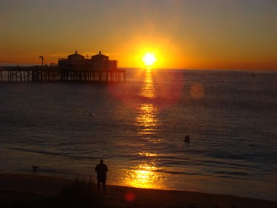 Sunrise over a pair of pelicans and a photographer trying to catch a photo of them at Surfriders beach at the Malibu Pier. Anyone who has never made a mistake has never tried anything new. …Albert Einstein