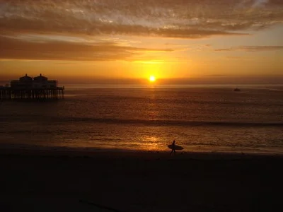 Sunrise as a surfer rushes to the surf. Things change. People come and people go. Our paths always call us to our greater-yet-to-be. Grateful for life’s miraculous intersections. Common sense is the collection of prejudices acquired by age eighteen. … Albert Einstein