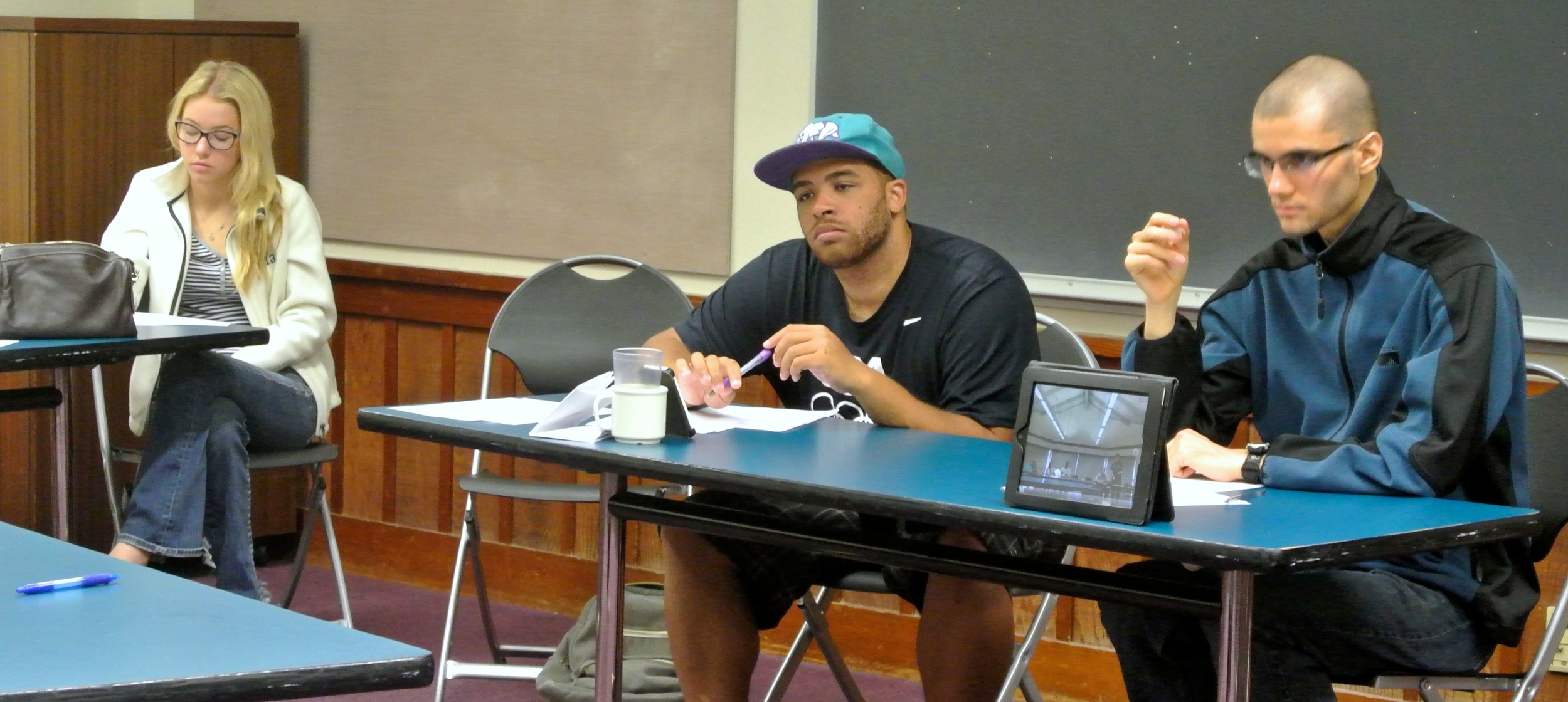 From left to right: Caitlin Walsh, David Saulet, and Artem Raskin adjudicate the final round.