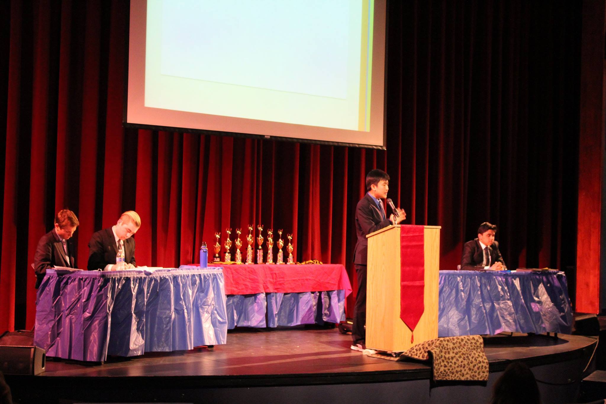 Irvington's William Yoo speaks in finals as partner Rishabh Meswani and tournament champions Benjamin Curl & Jasper Feinburg flow. Image courtesy of Shannon Bonet.