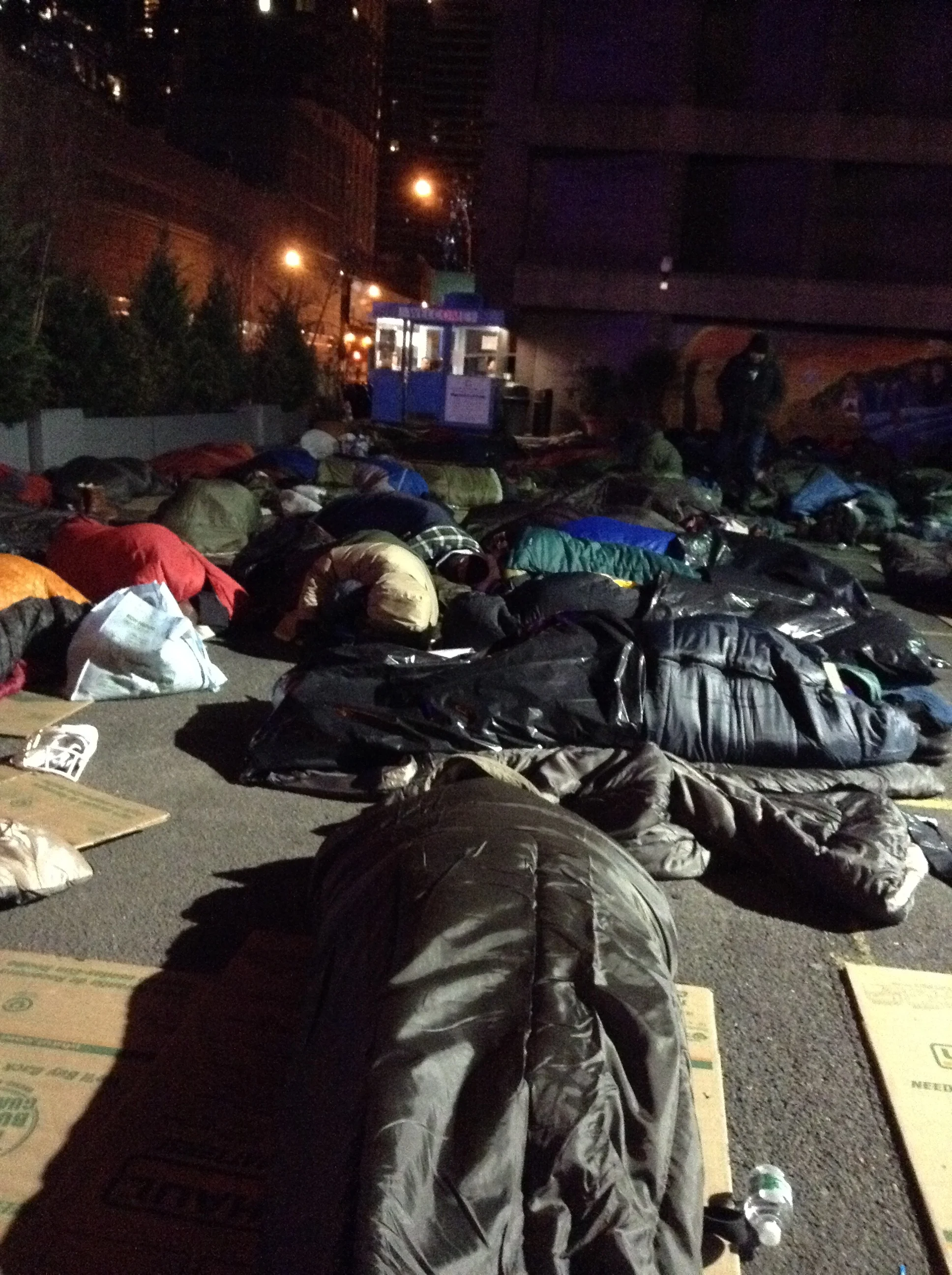 Business execs sleeping out in a NYC Parking lot - surreal!