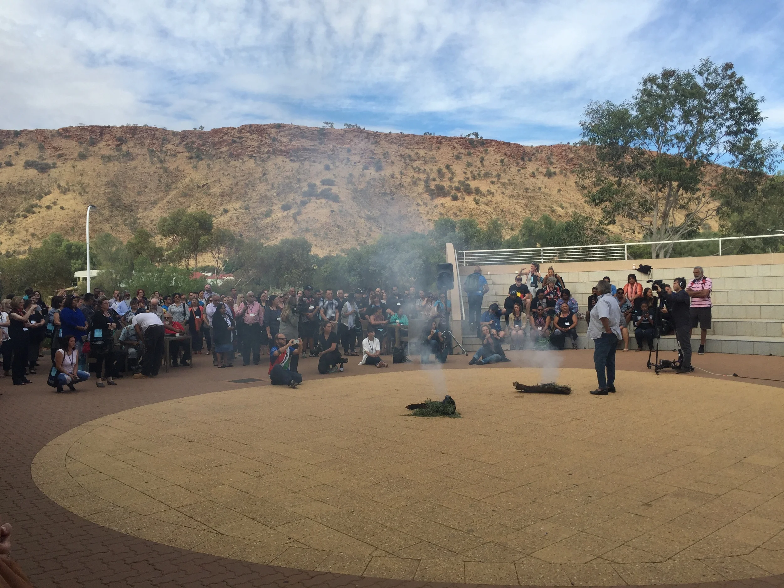 Smoking ceremony at the foot of the caterpillar mountains which are part of the story of Alice Springs & Arrente people