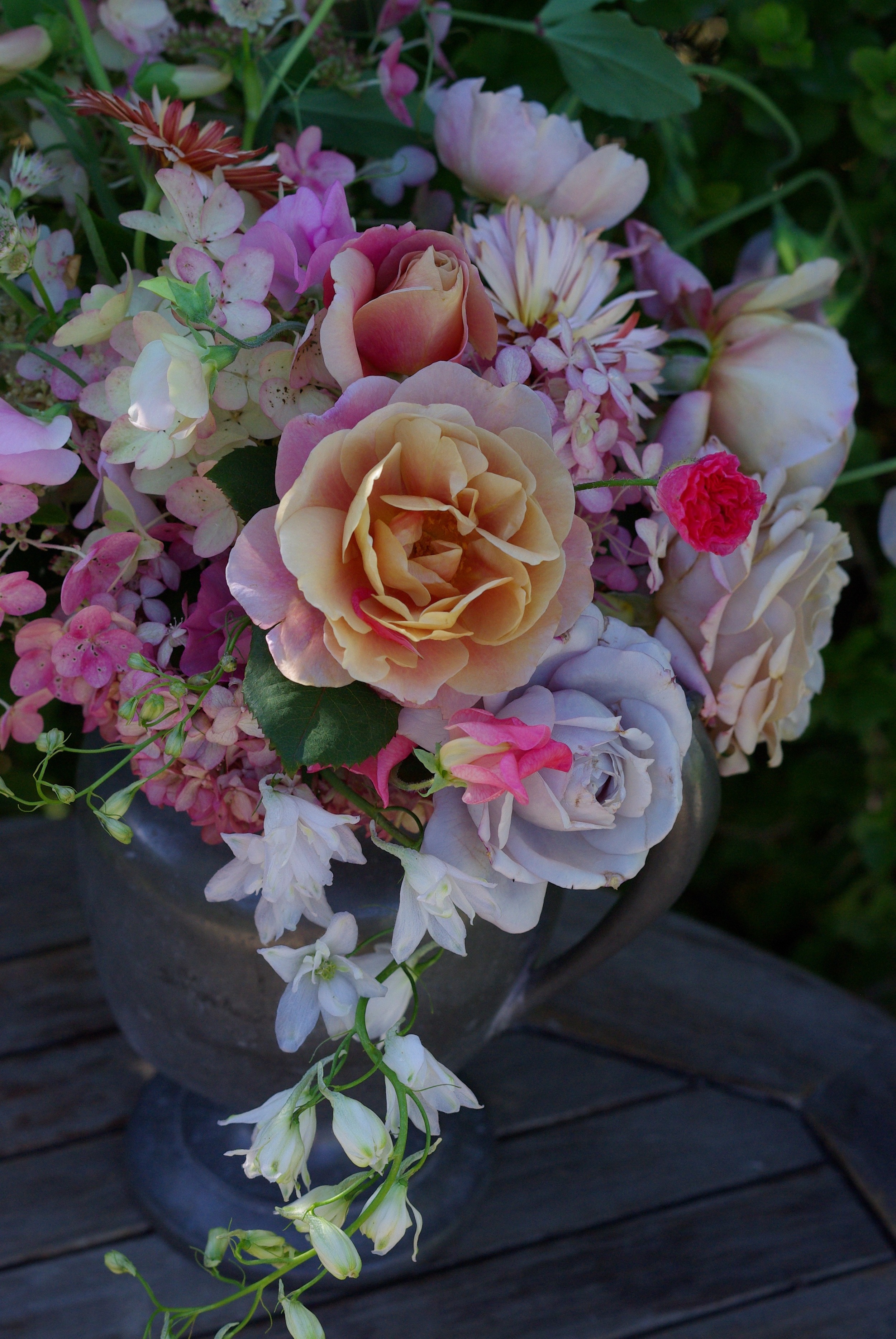 Early September - delphinium, hydrangea, roses, sweet peas, shirley poppies, calendula, astrantia