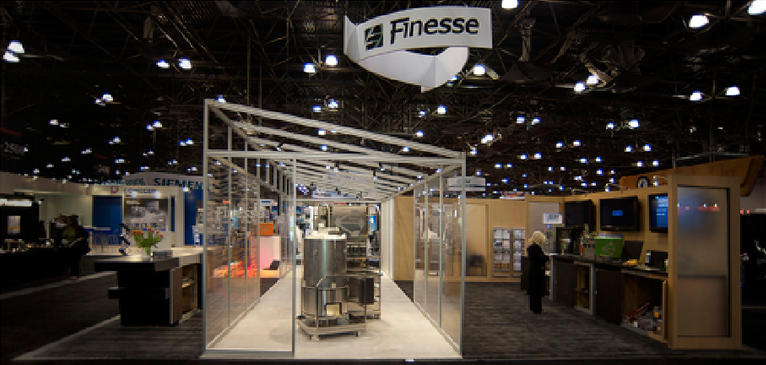 Finesse Solutions “Clean Room” trade show booth, “F” reception desk and product presentations