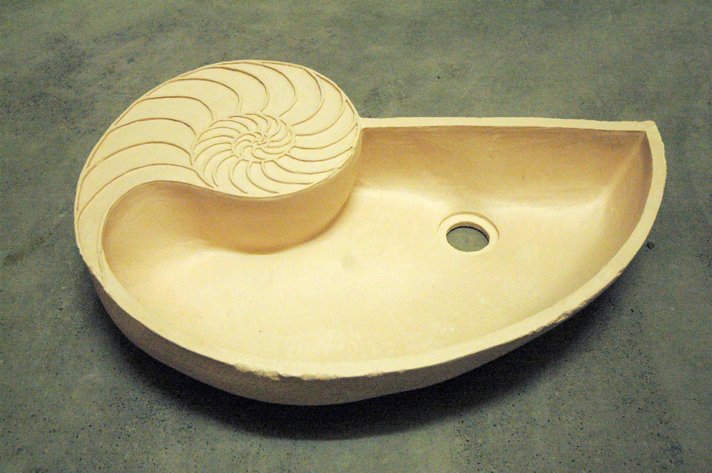 This basin is currently at the bisque stage of production, ready to glaze as desired.