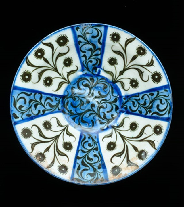 Dish with lustre pattern, Iran, probably Kashan, about 1200 AD. Glazed fritware, with lustre painted over the glaze. Museum no. C.158-1977.