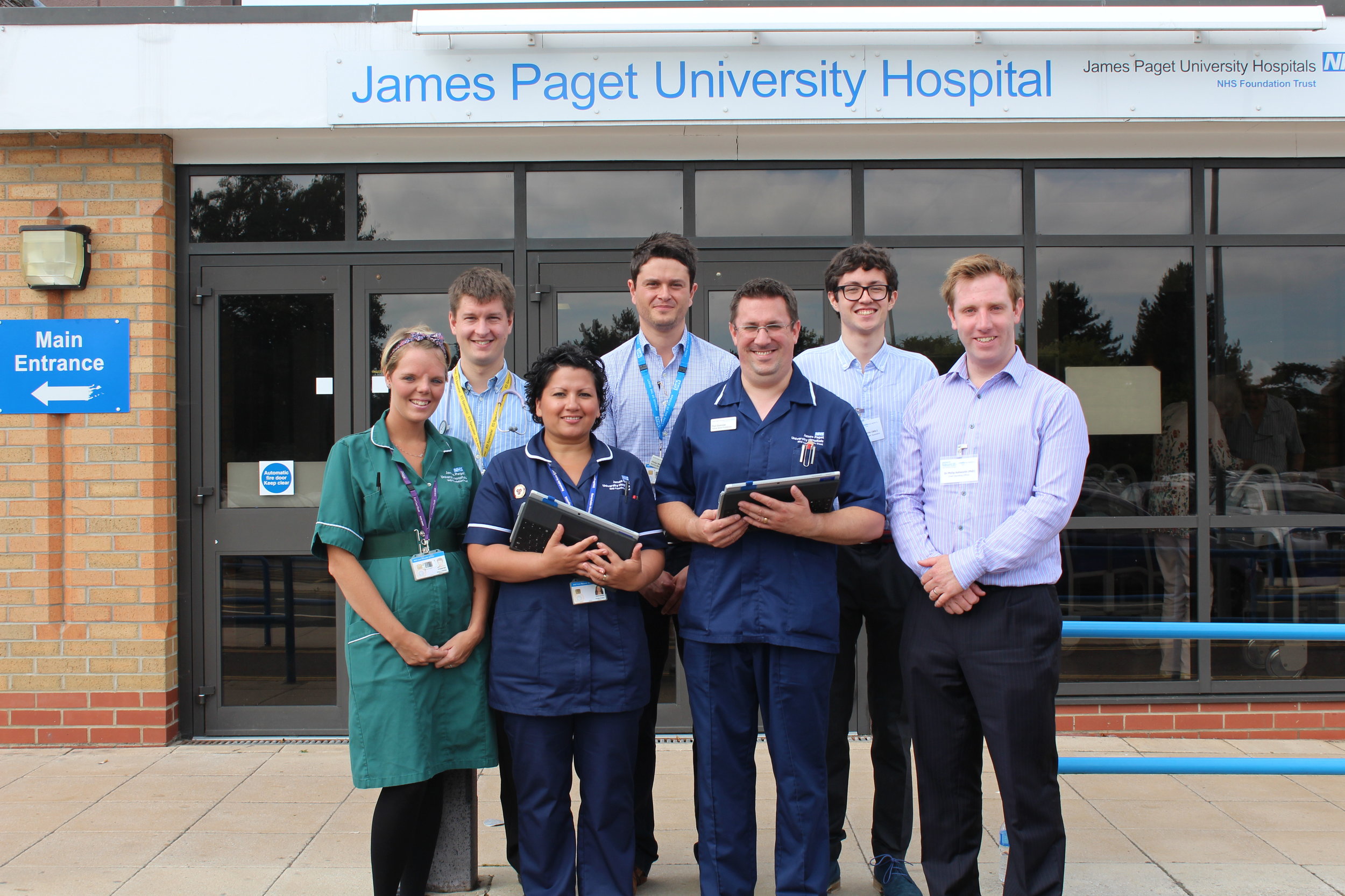 James Paget Hospital Ambulatory Care Unit staff standing with members of the PatientSource team outside of JPUH (Photography by Laura Crisp)