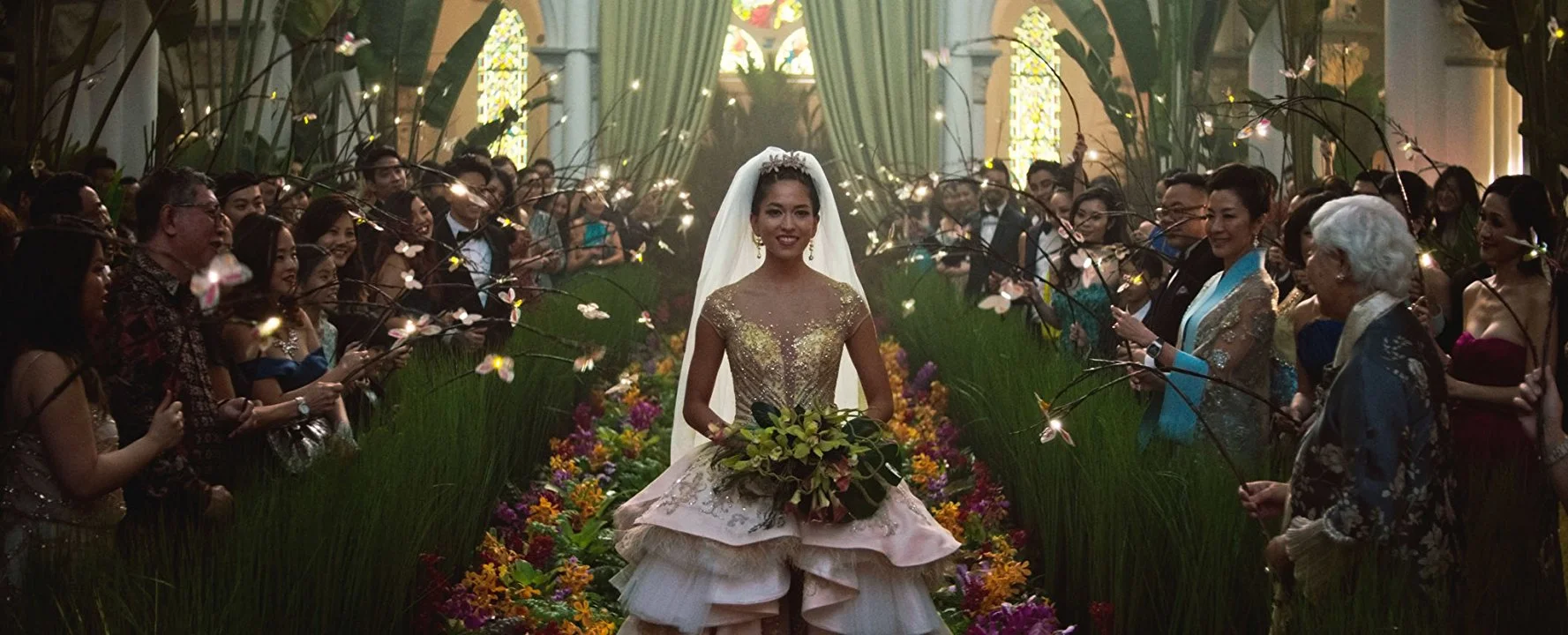 This doesn't necessarily register to me as an "Asian wedding" ...unless it's in an "Asian movie." But it is an over-the-top wedding, which is just Hollywood being itself.
