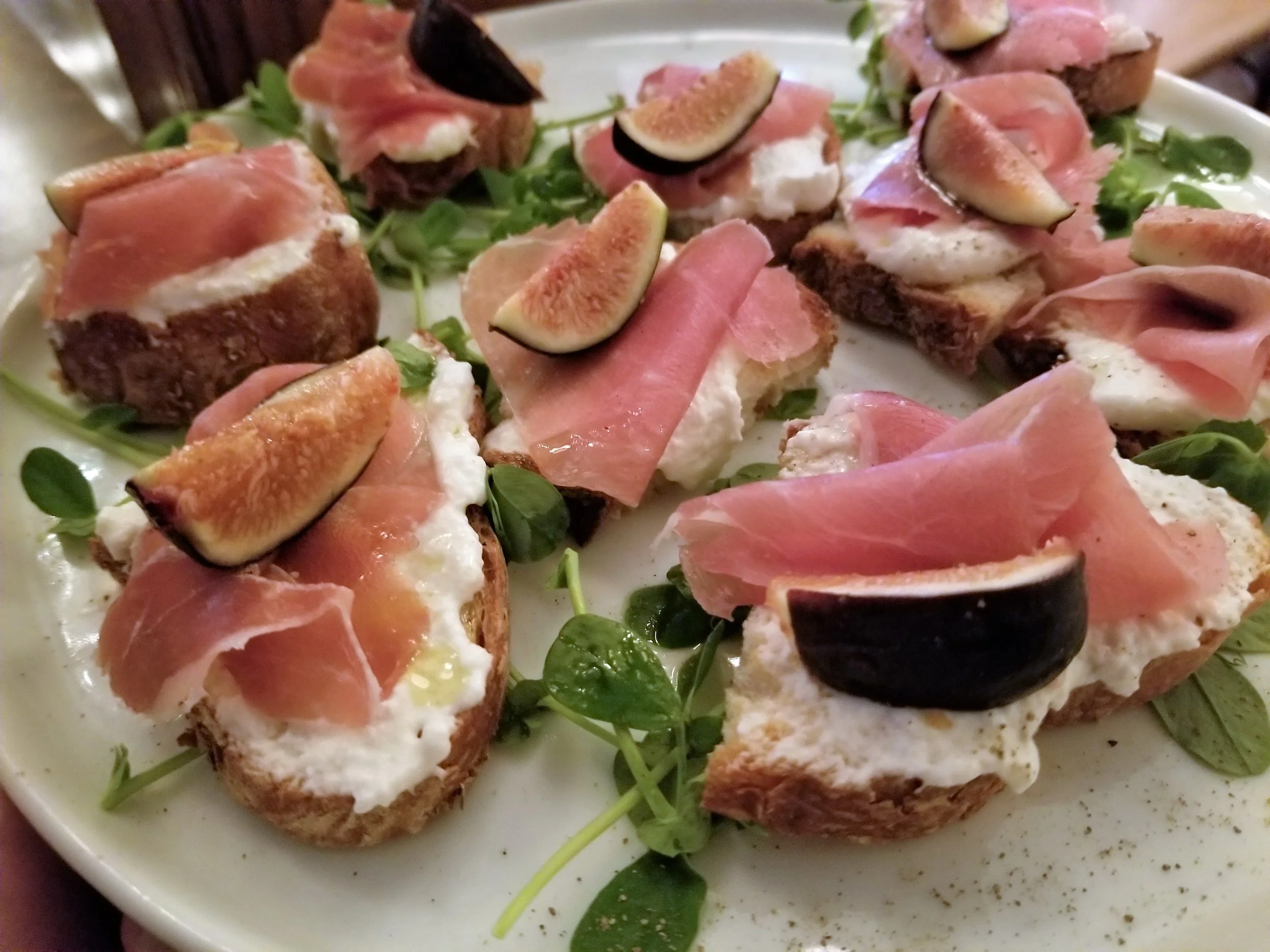 Bruschetta: roasted figs, buratta, Prosciutto di Parma