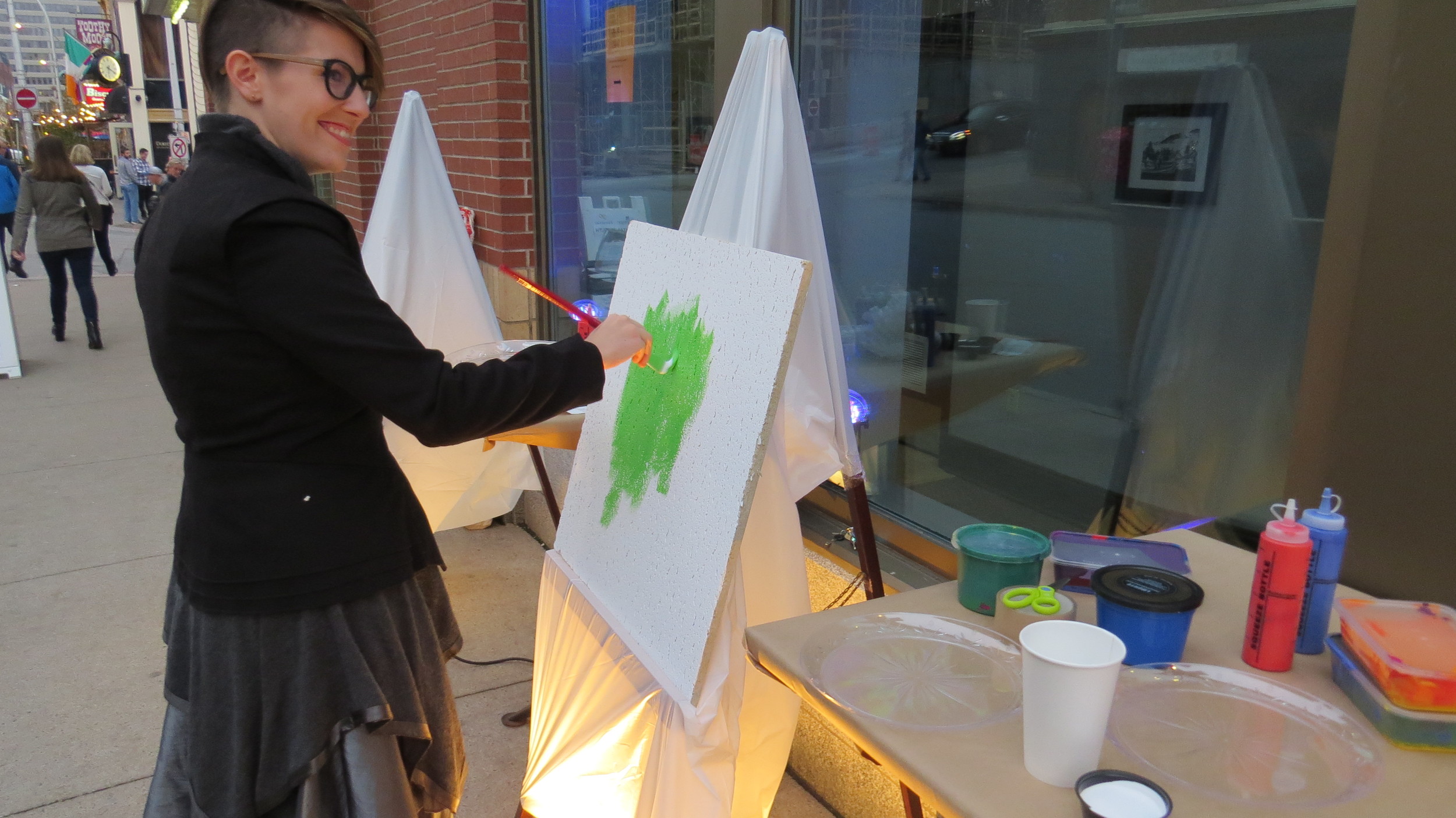 Artist Colleen MacIsaac painting her tile at Nocturne Halifax, Oct. 18
