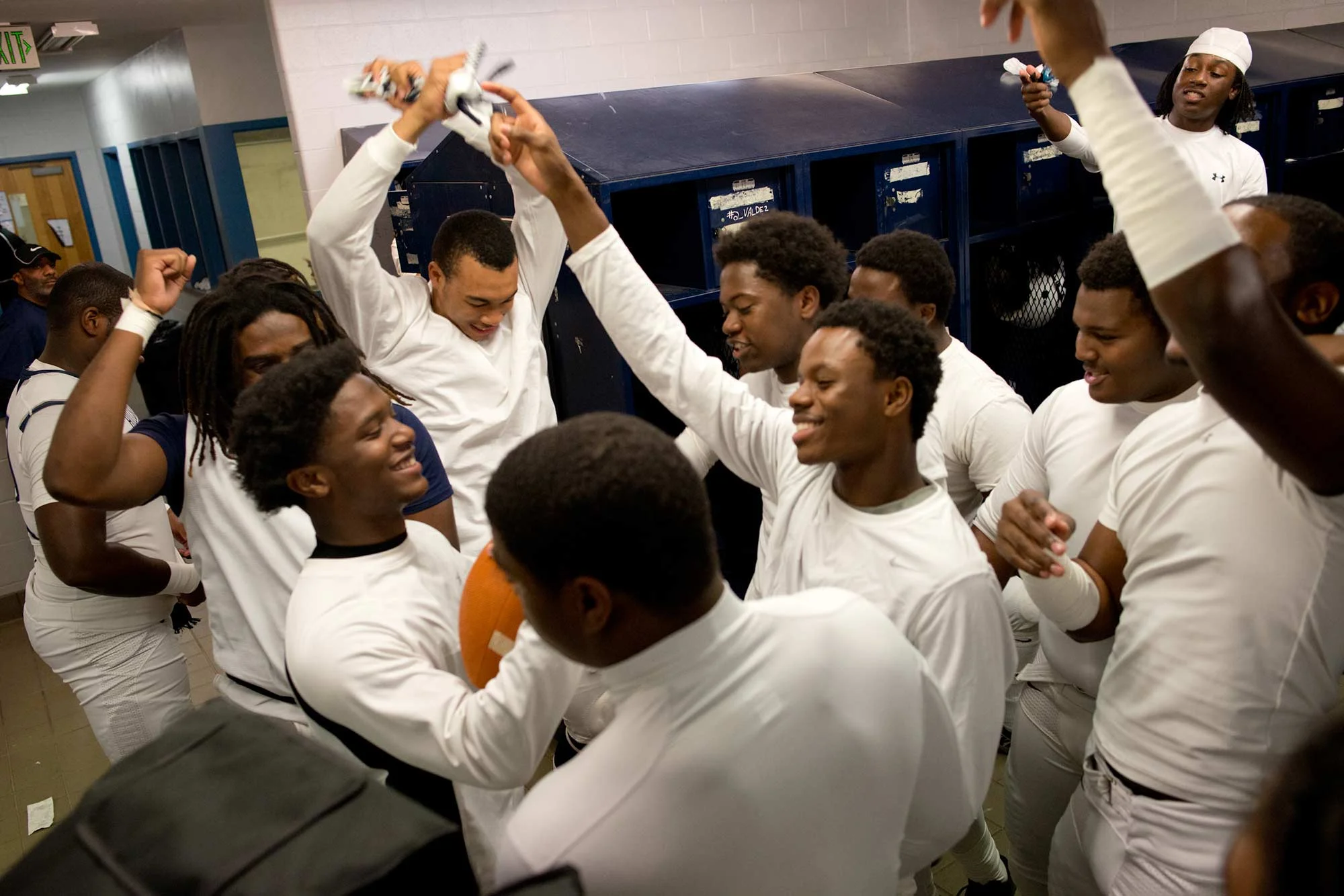 The Hillside squad prepares for the first round of play-offs with a locker room dance party before heading onto the field for warm-ups. Coach Linquan Jones, a 2007 Hillside alum, says, "This is family. Once you're here, you're here. Guys will keep coming back for the love of the game."