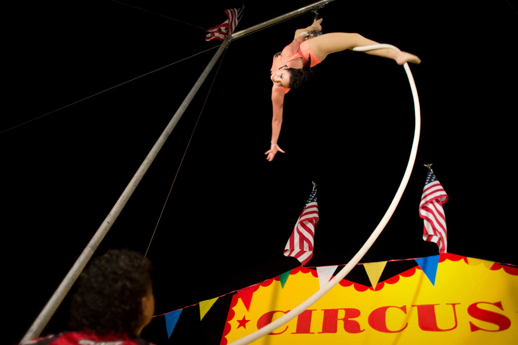 Liza performs aerial ballet during the final show of the night while Oscar controls the rope from below.
