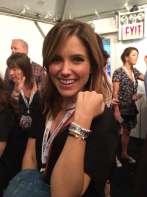Sophie Bush wearing the Childhood signature bracelet, showing her support for all children's right to a childhood. Photo by: Tara Derakshan