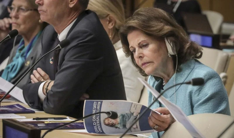 Queen Silvia of Sweden, founder of the World Childhood Foundation, reviews a report on child online safety from the Broadband Commission for Sustainable Development, during a high level meeting at the United Nations, October 1, 2019.