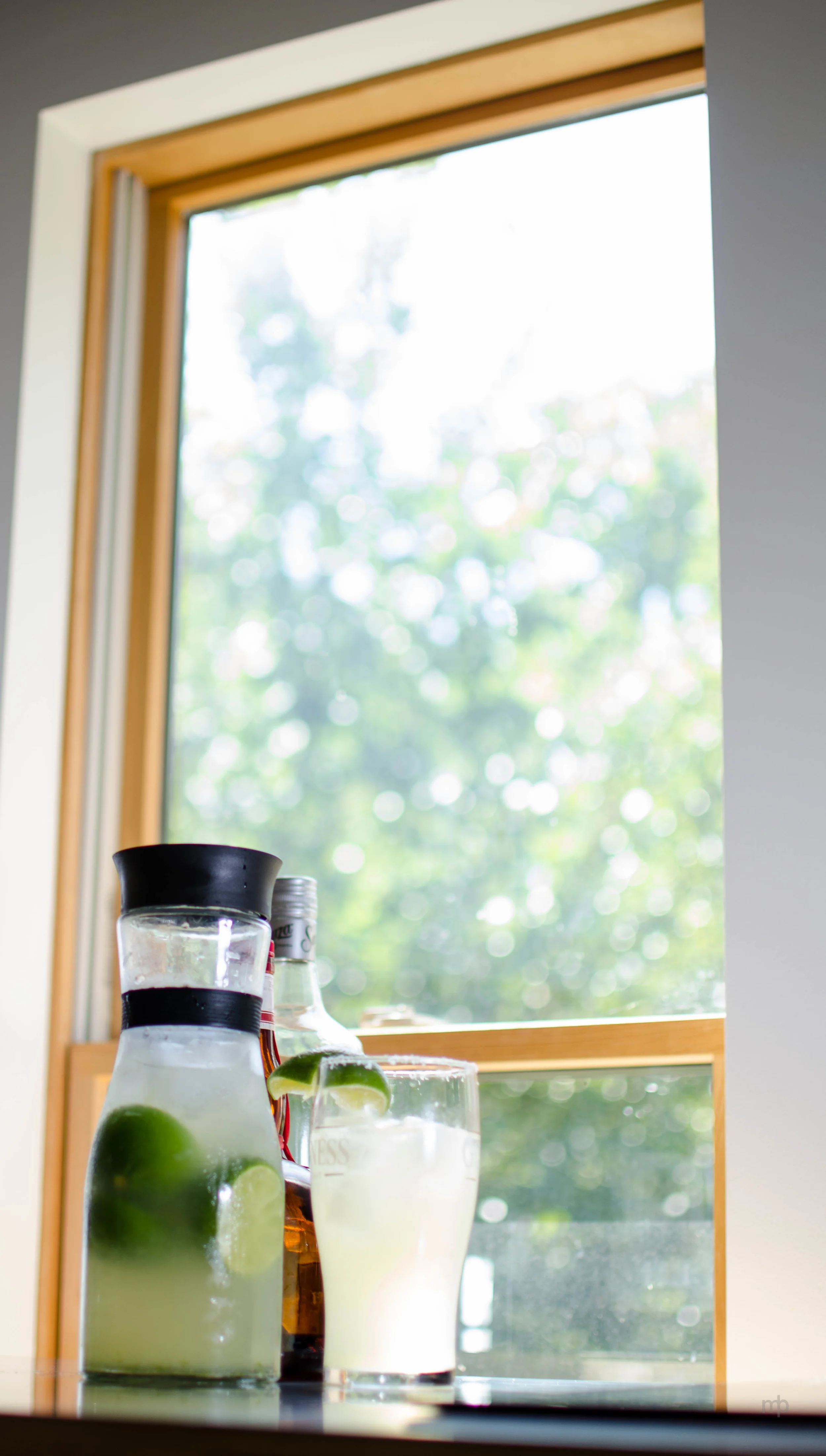 Margarita in the Window. Nikon D7000, Nikkor 35mm, ISO 100, f/1.8, 1/200 sec. 