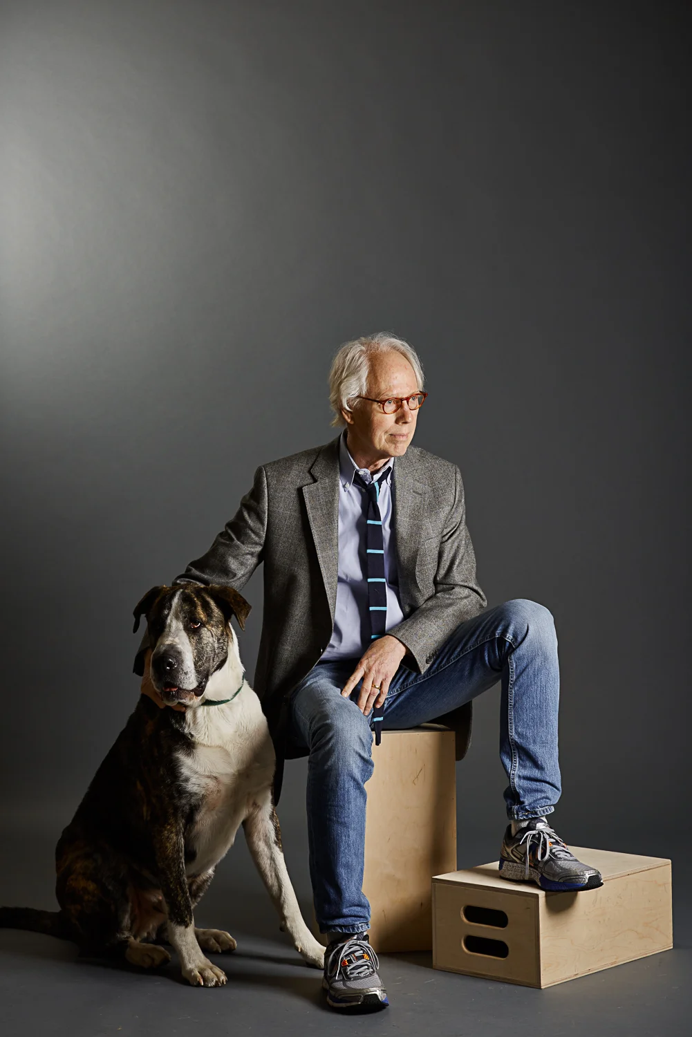 moody portrait of a older man and his dog