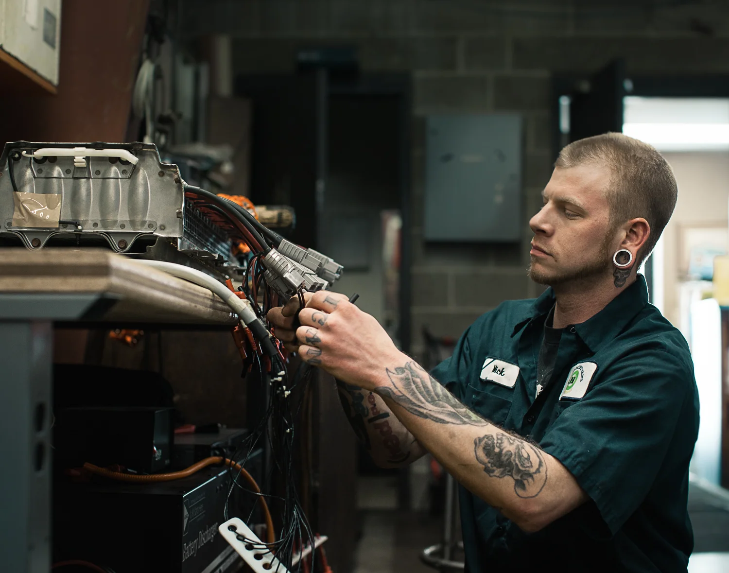 auto mechanic working on car