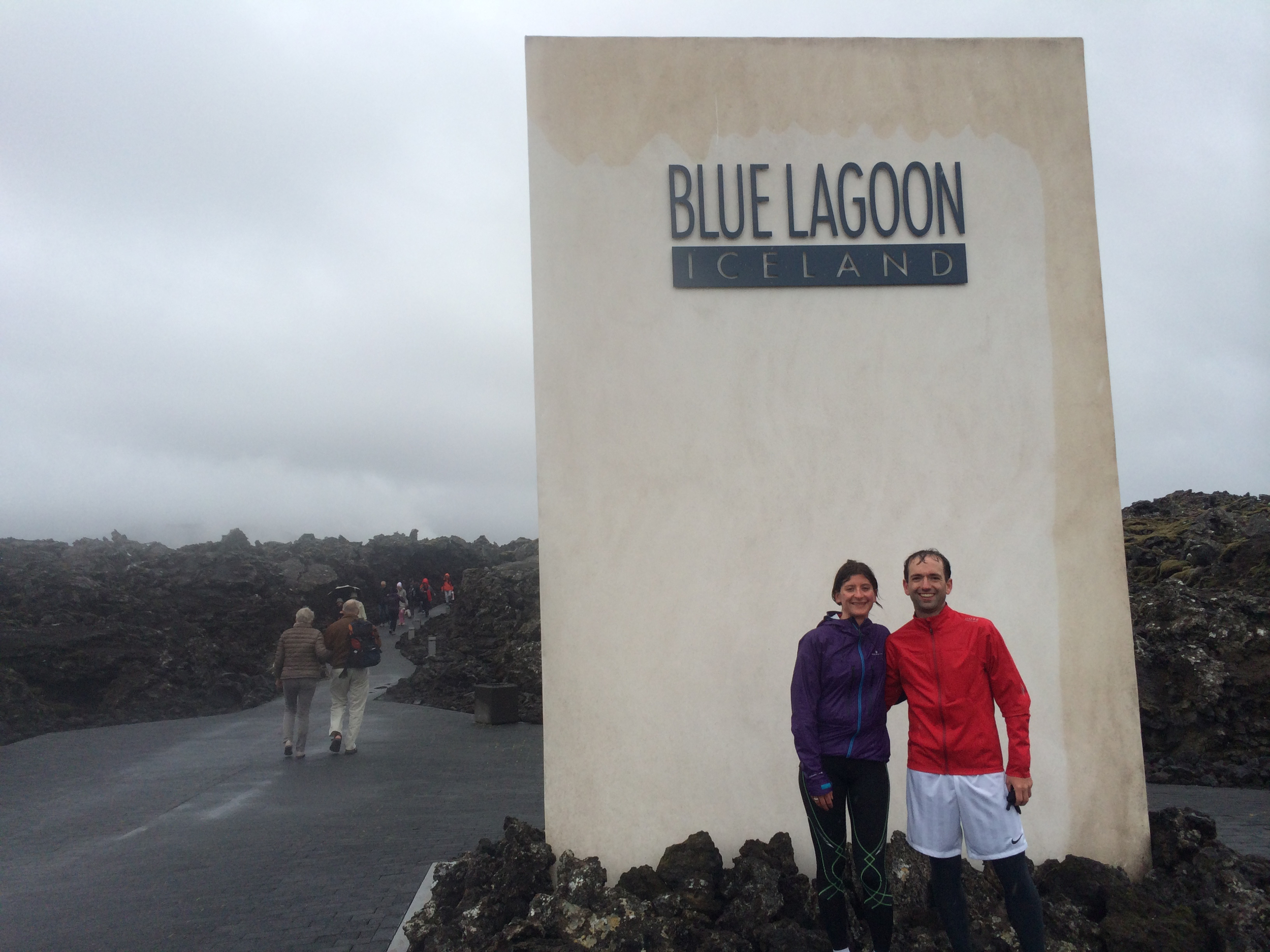 Standing in front of a big Blue Lagoon badge