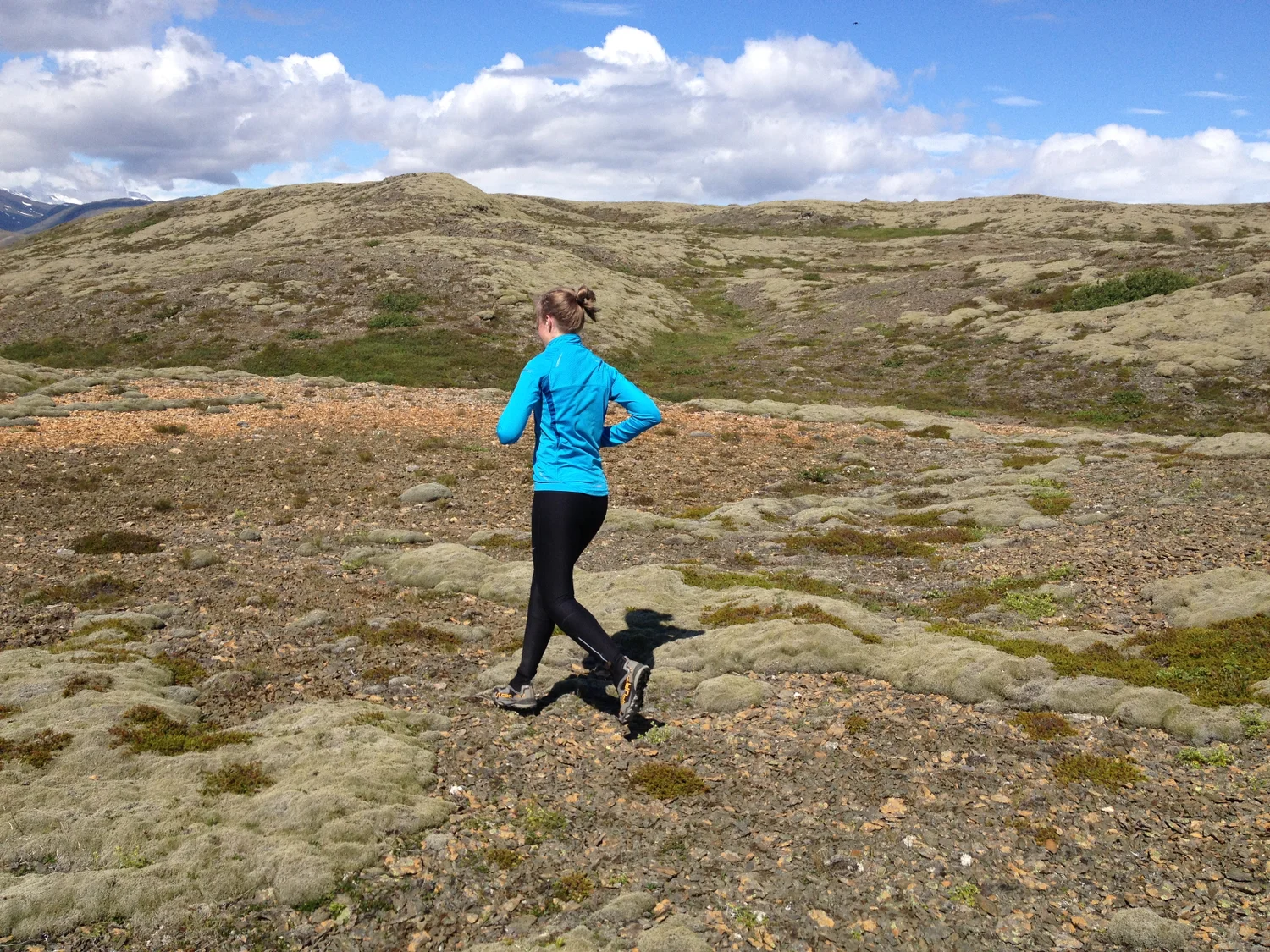 Running in a mossy and barren landscape