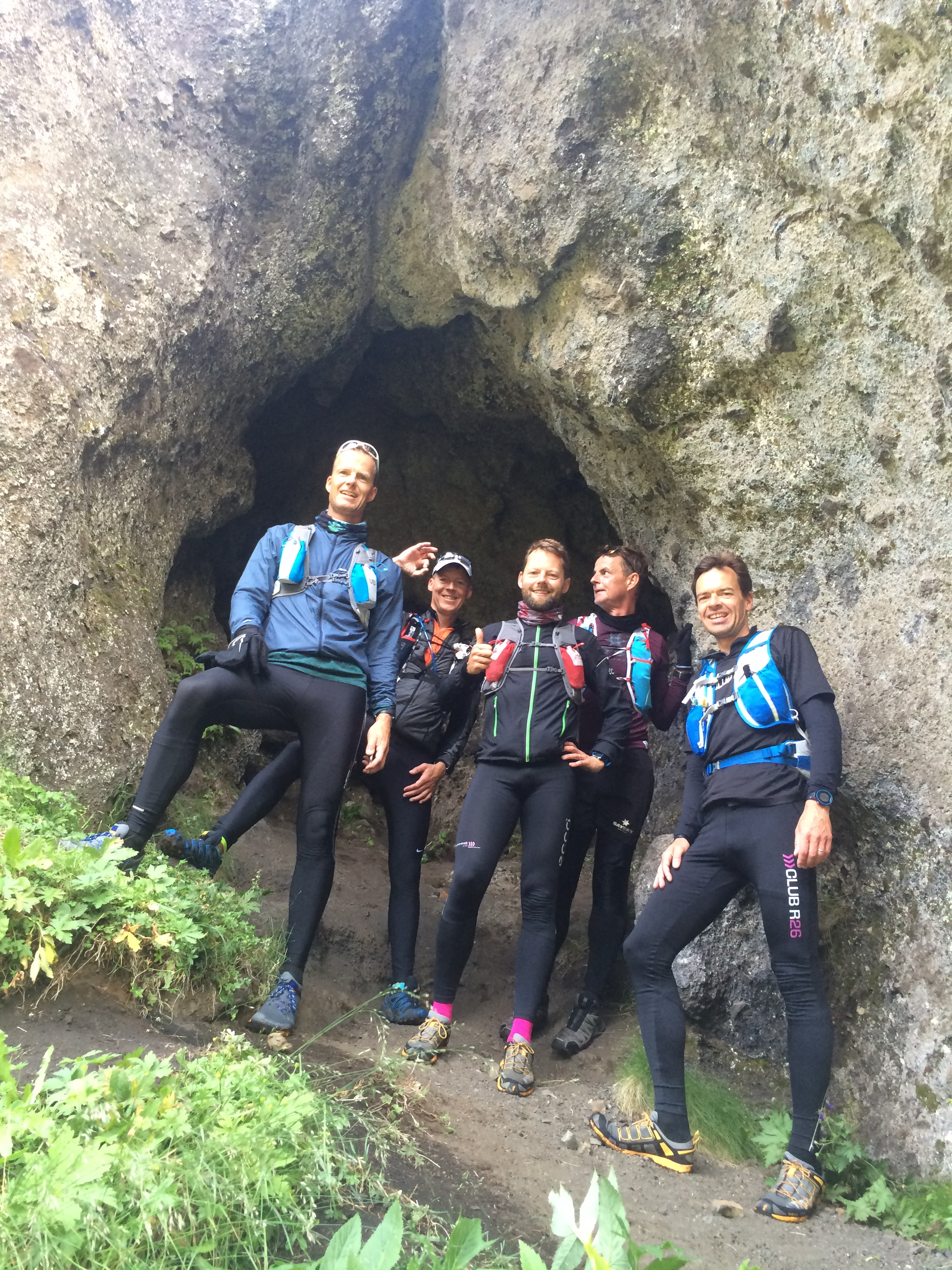 Runners relaxing in front of a Cave