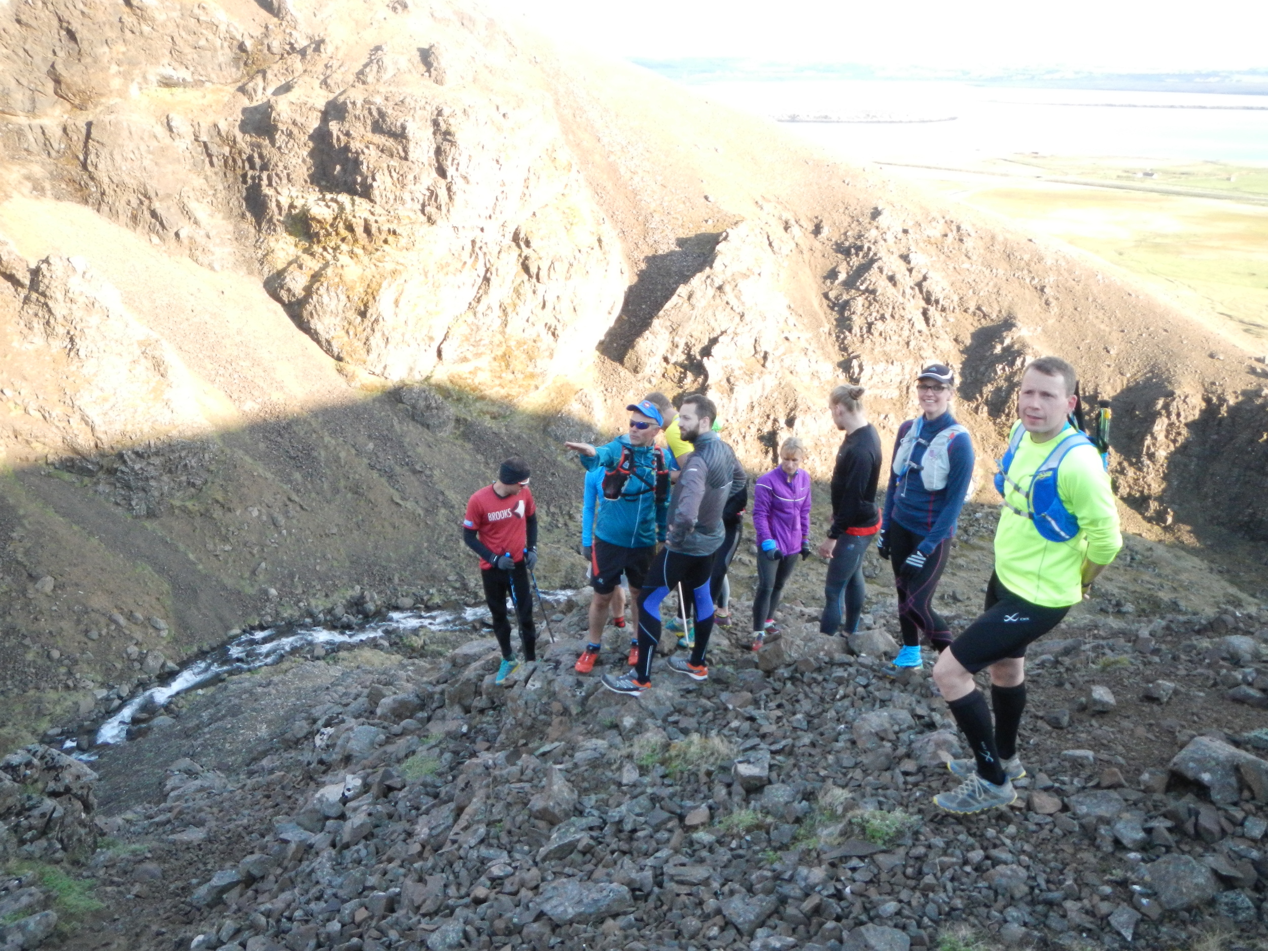 A running group looking around in a ravine