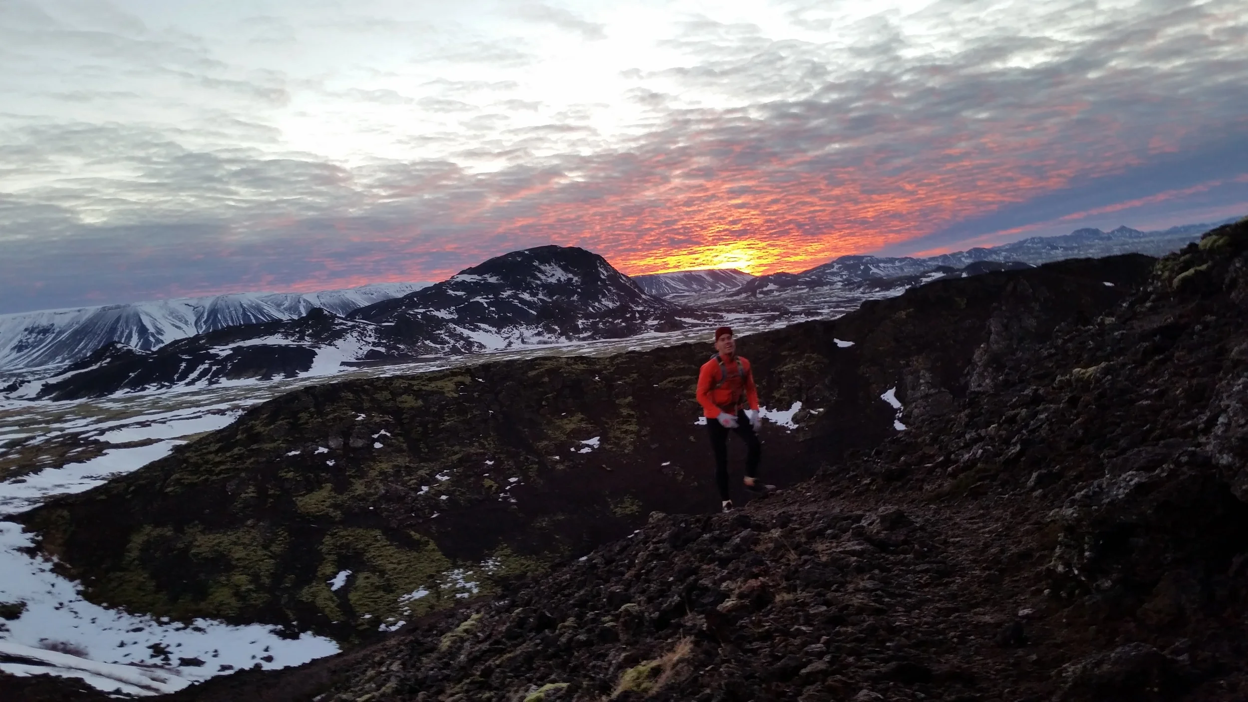 Running upwardly with a sunset in the background