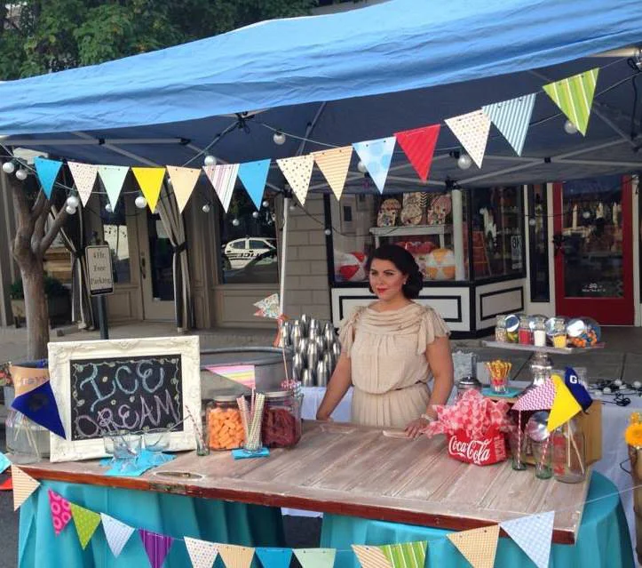A fun, vintage soda shop setup for the grand opening of a restaurant, complete with servers in 1950's attire. 