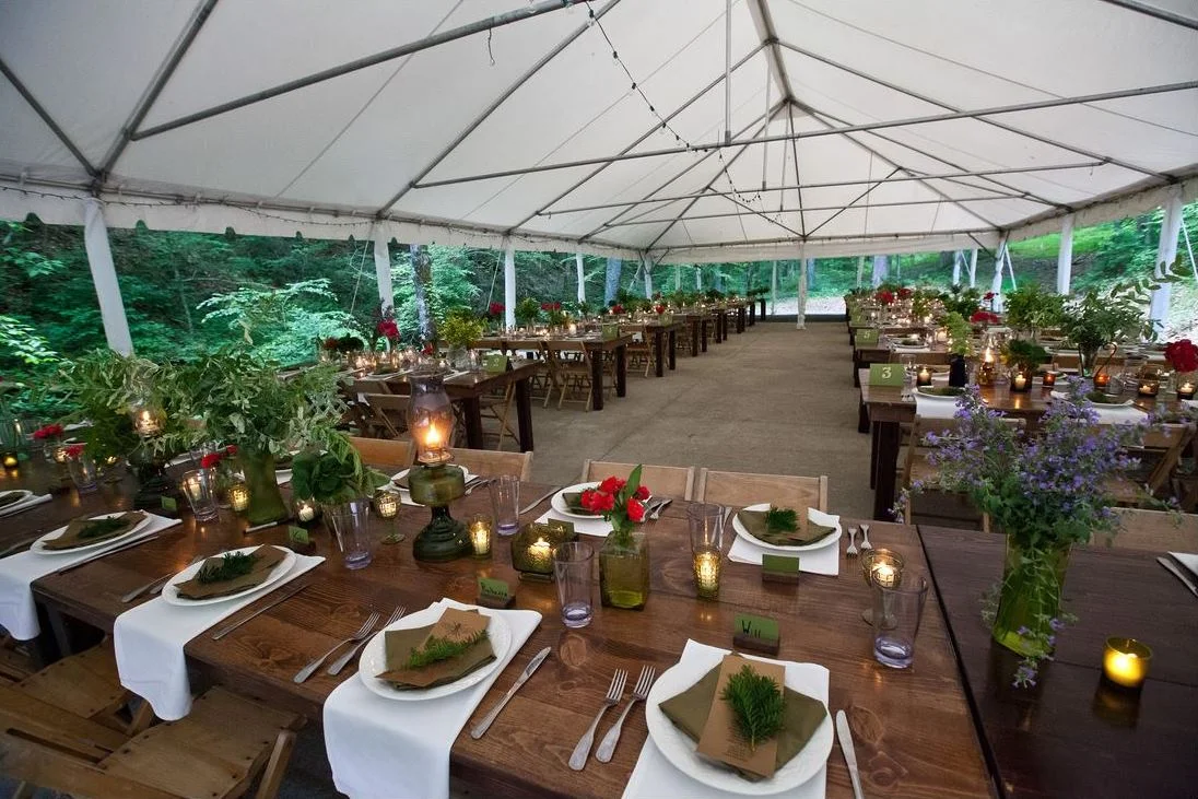 outdoor tented reception greenery flowers