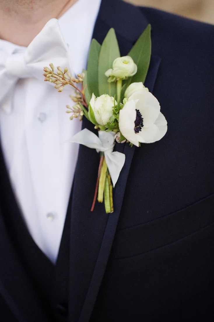 groom boutonniere anemone.jpeg