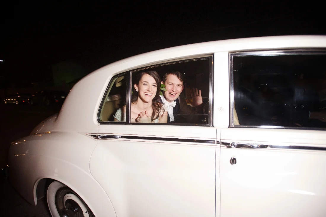 bride and groom in classic car.jpeg
