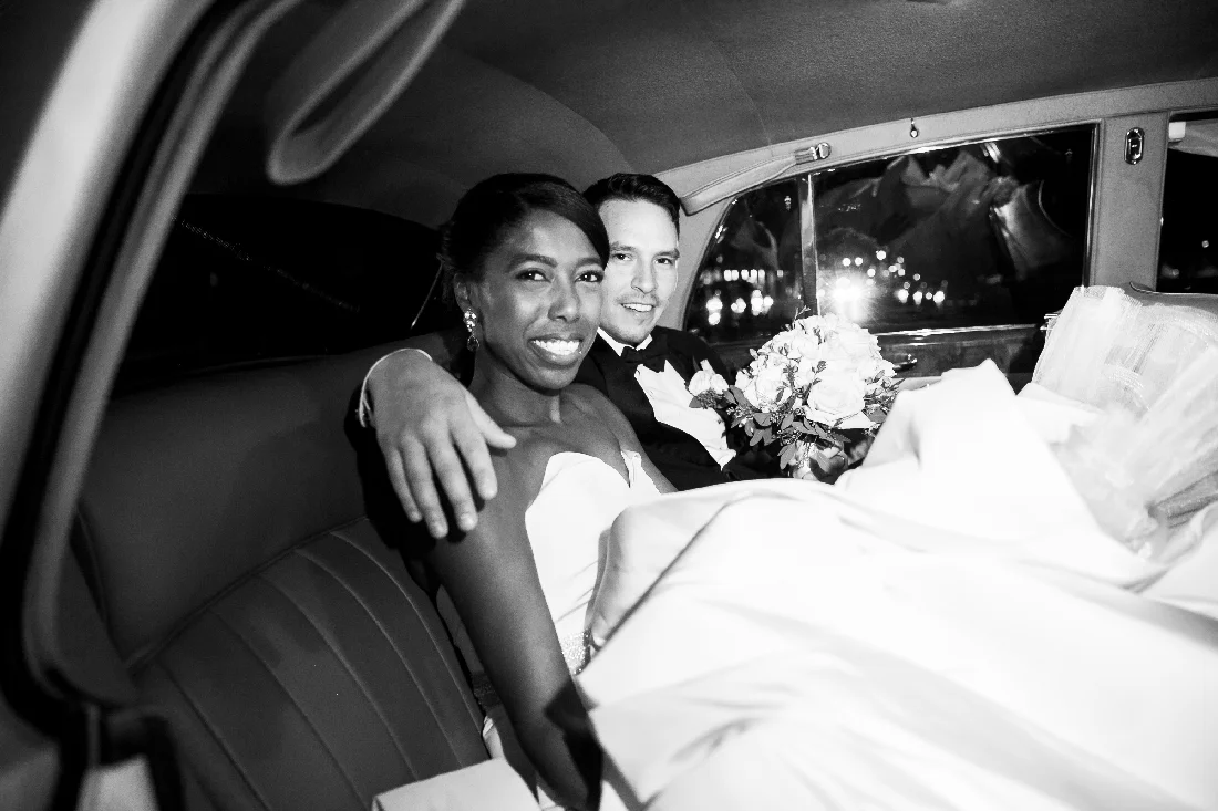 bride and groom in car.jpeg