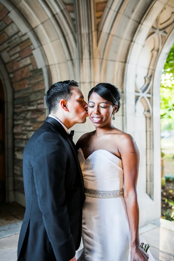 groom kissing brides cheek.jpeg